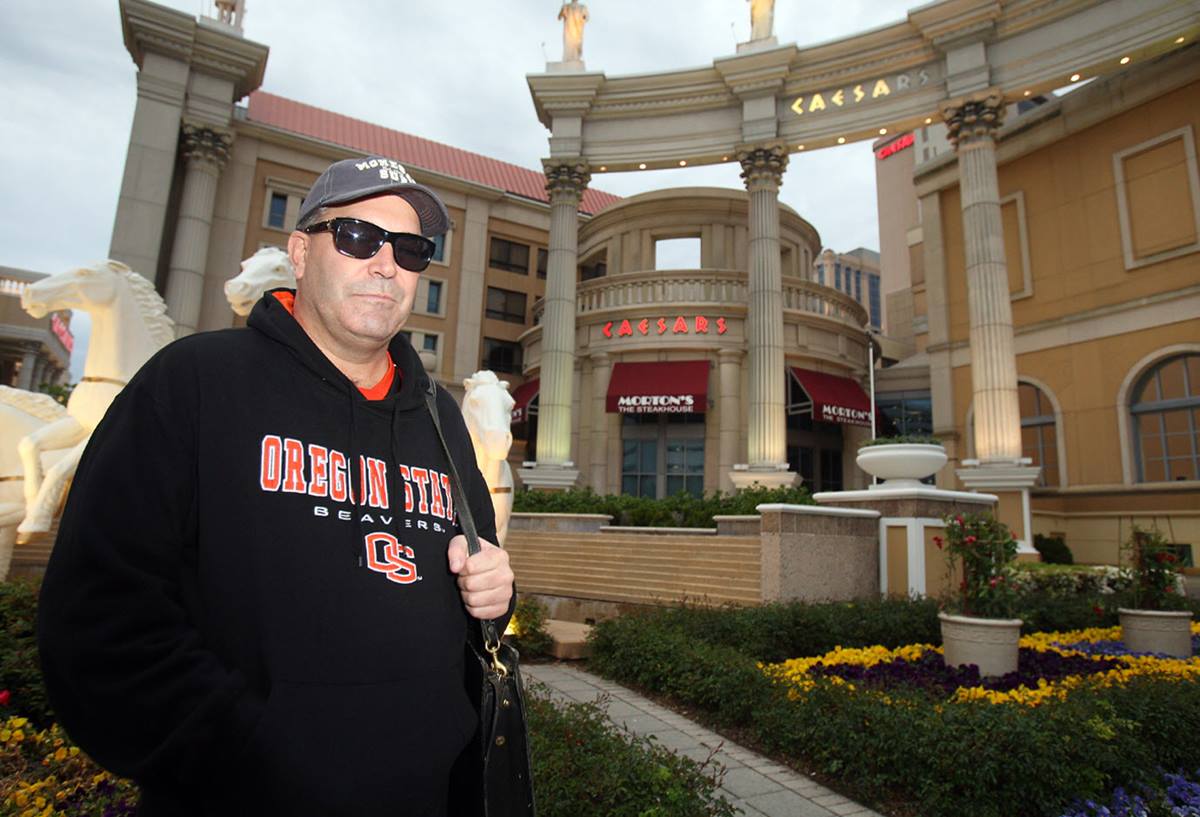 Don Johnson posing in front of Caesars Casino